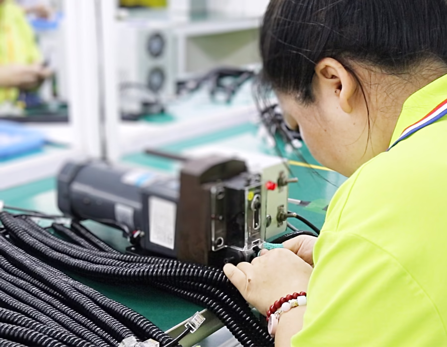 Romtronic employees are manufacturing coiled cables