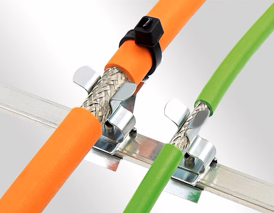 Clamp-style shield termination on industrial cable