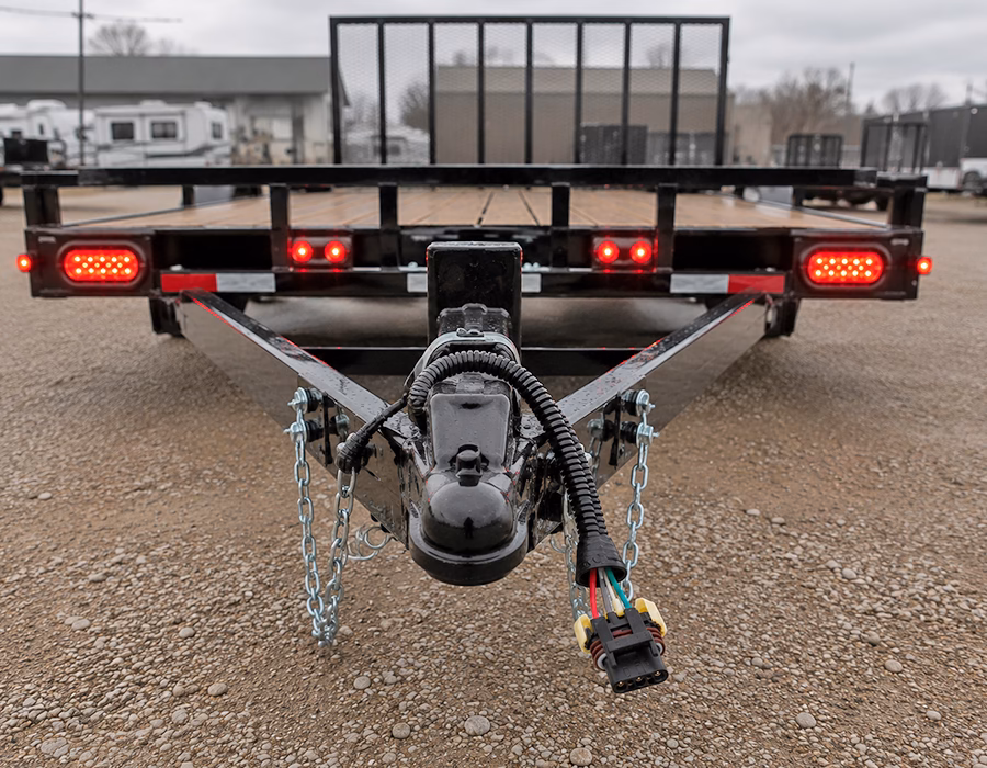 Weatherproof cable assemblies connected to LED lighting on an outdoor utility trailer.