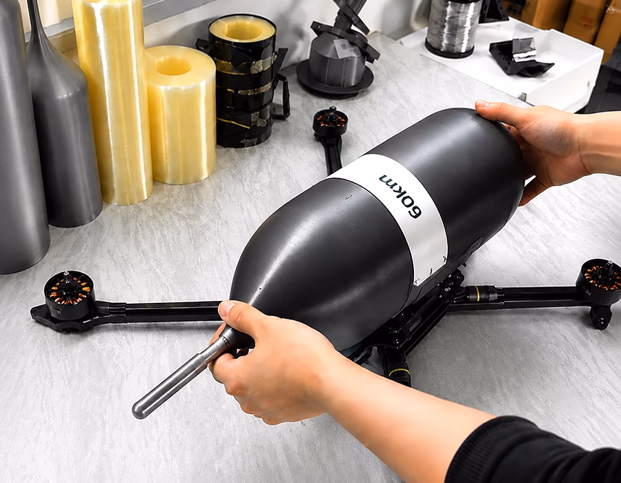Fiber optic drone cable spool mounted on FPV drone